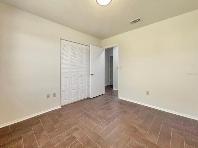 unfurnished bedroom featuring a closet