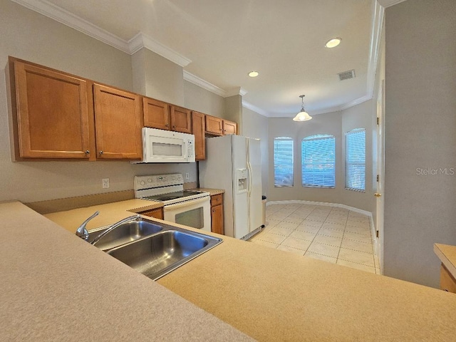 kitchen featuring pendant lighting, white appliances, crown molding, sink, and light tile patterned flooring