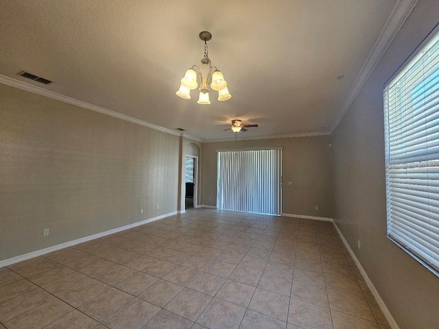 tiled spare room featuring ceiling fan with notable chandelier and ornamental molding