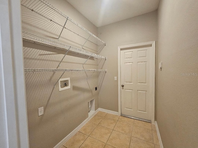 laundry area featuring hookup for an electric dryer, washer hookup, and tile patterned floors