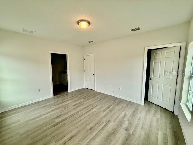 unfurnished bedroom featuring light hardwood / wood-style flooring