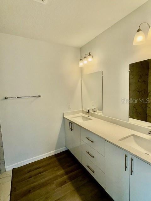 bathroom featuring hardwood / wood-style floors and vanity