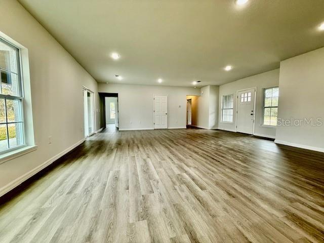 unfurnished living room featuring light hardwood / wood-style floors