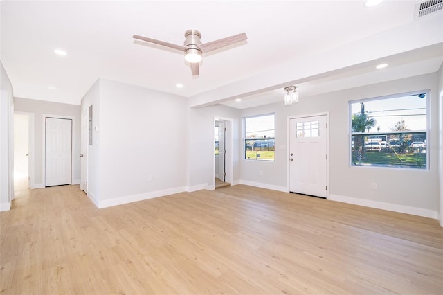 foyer with light wood-type flooring and ceiling fan