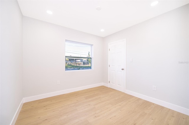 unfurnished room featuring light hardwood / wood-style floors