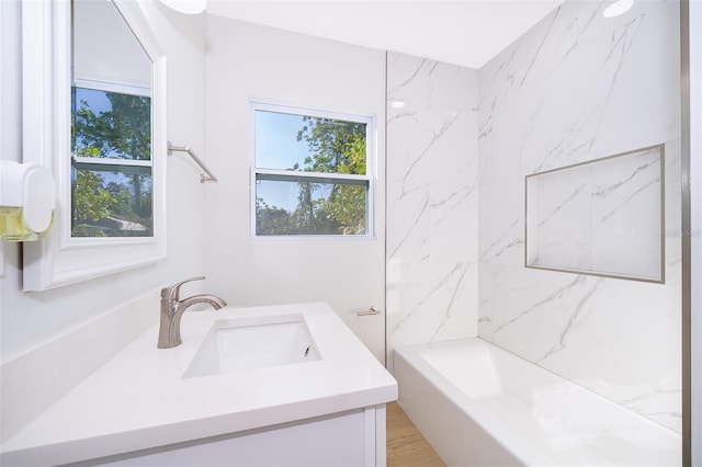 bathroom with vanity and shower / washtub combination