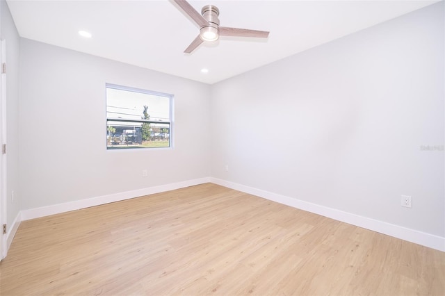 spare room featuring ceiling fan and light hardwood / wood-style floors