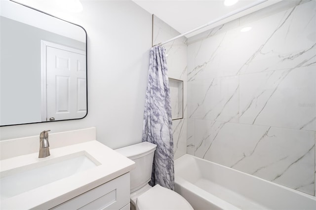 full bathroom with shower / bath combo with shower curtain, vanity, and toilet