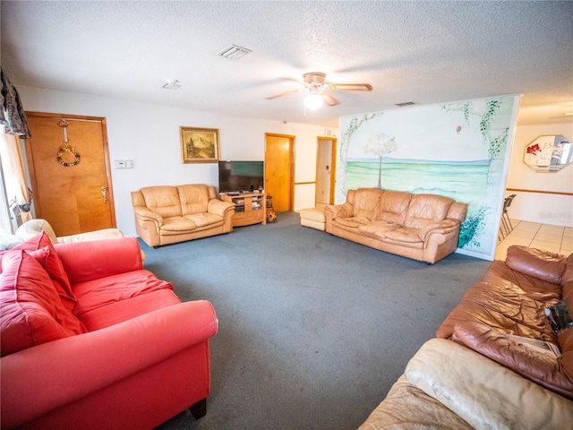 living room with dark colored carpet, a textured ceiling, and ceiling fan