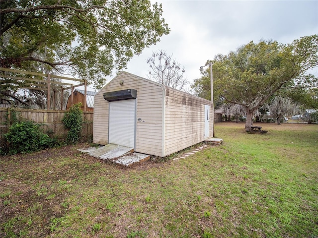 view of outbuilding featuring a yard