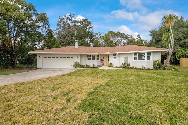 ranch-style house featuring a front yard and a garage