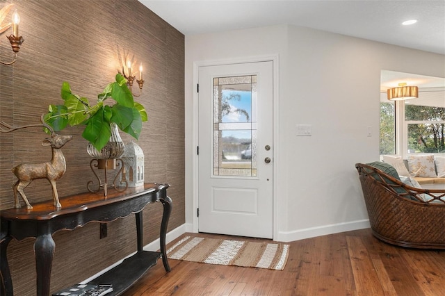 entrance foyer with hardwood / wood-style floors and a healthy amount of sunlight