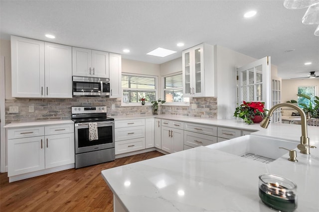 kitchen featuring white cabinets and stainless steel appliances