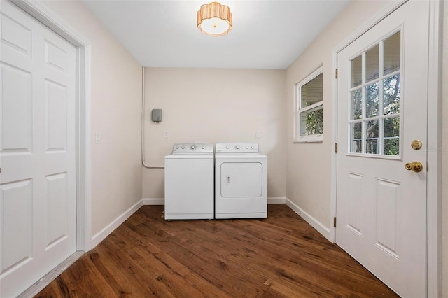 clothes washing area featuring dark wood-type flooring and washing machine and clothes dryer