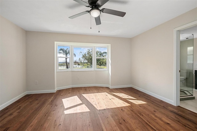 unfurnished room with ceiling fan and wood-type flooring