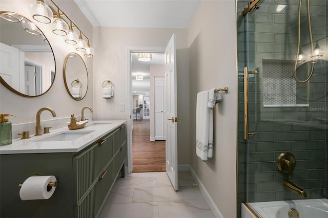 bathroom with vanity and tiled shower / bath