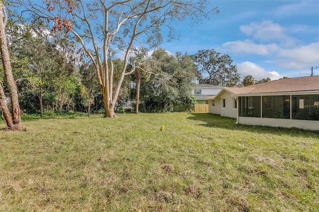 view of yard with a sunroom