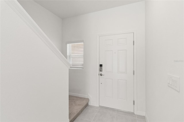 foyer with light tile patterned flooring