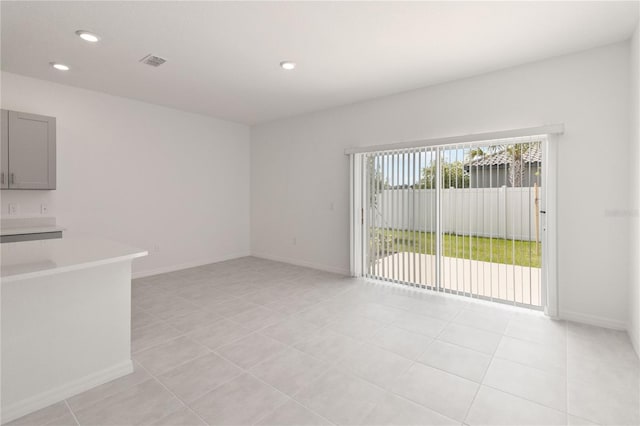 unfurnished living room with light tile patterned floors