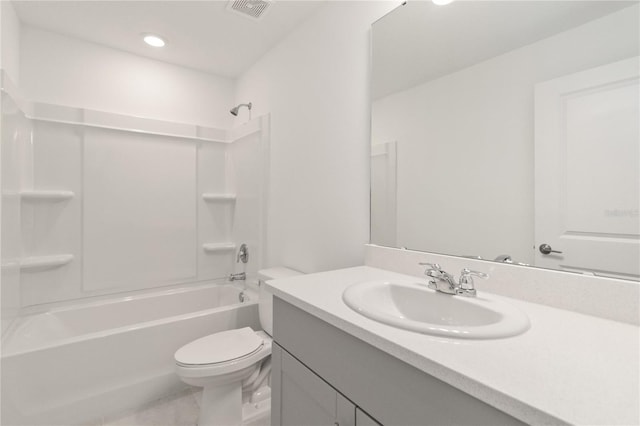 full bathroom featuring vanity, bathtub / shower combination, and toilet