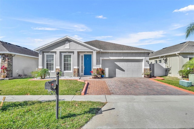 ranch-style home with a front yard and a garage