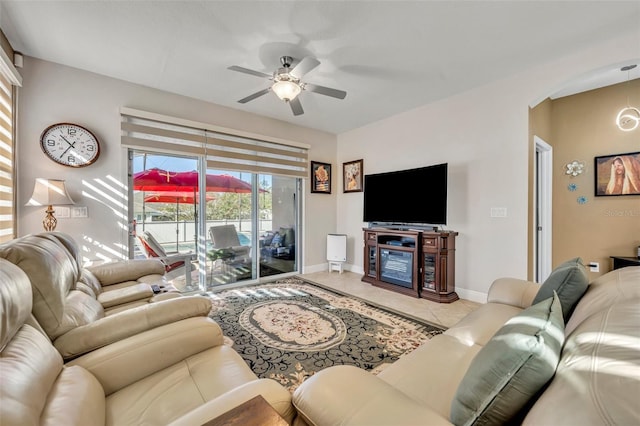 tiled living room featuring ceiling fan