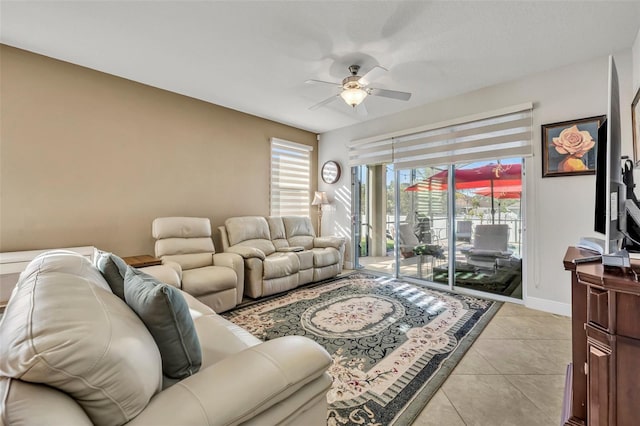 tiled living room with ceiling fan