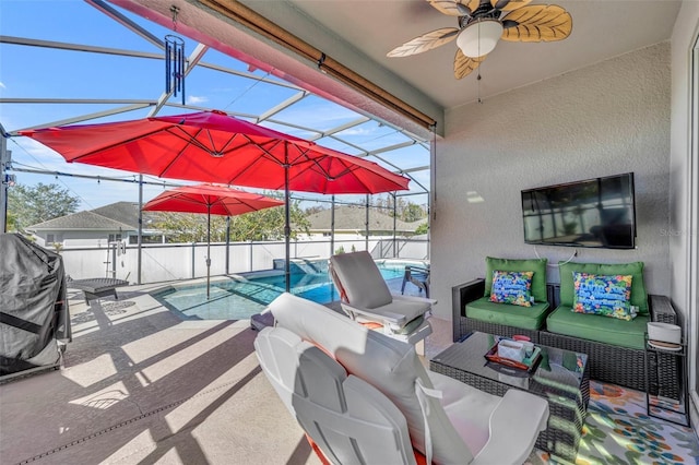 view of patio featuring a fenced in pool, an outdoor living space, ceiling fan, and a lanai