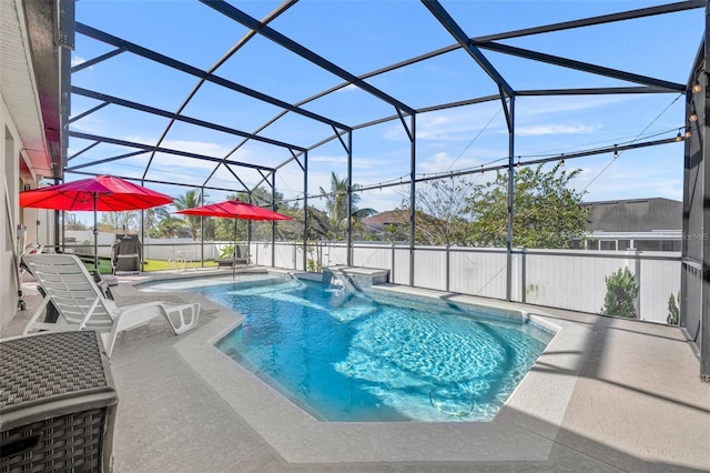 view of swimming pool featuring a lanai, pool water feature, and a patio