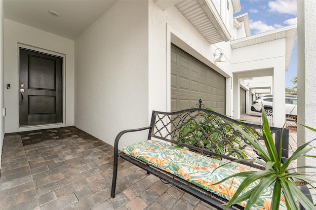 view of exterior entry with a garage