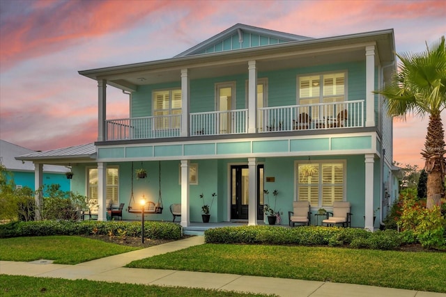 view of front of property featuring a balcony