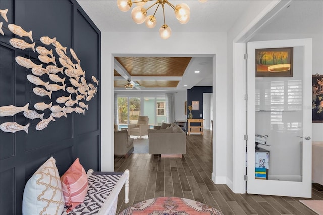 foyer with wood ceiling and ceiling fan with notable chandelier