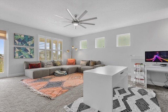 carpeted living room with ceiling fan