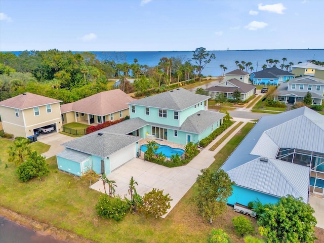 birds eye view of property featuring a water view