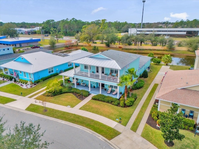 drone / aerial view with a water view