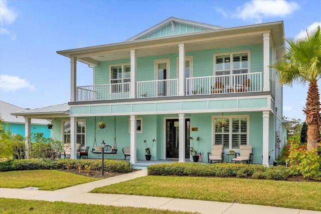 view of front of home featuring a balcony