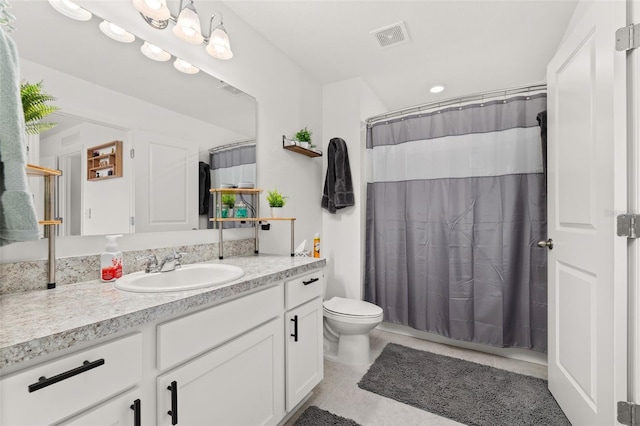 bathroom with tile patterned flooring, vanity, a shower with shower curtain, and toilet