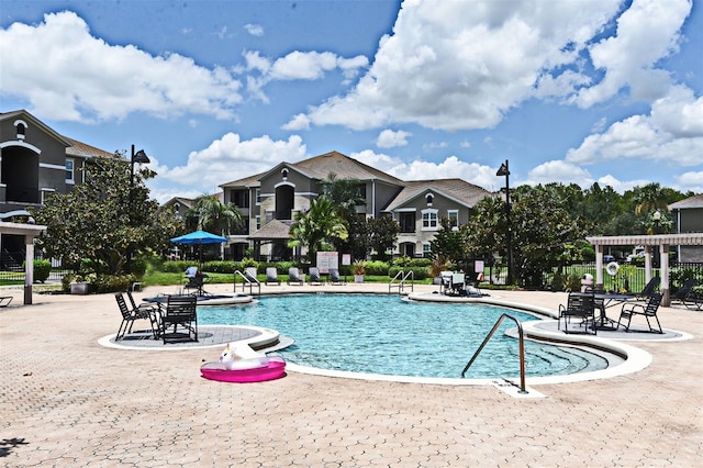 view of swimming pool with a patio