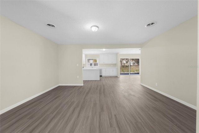 unfurnished living room featuring dark hardwood / wood-style flooring