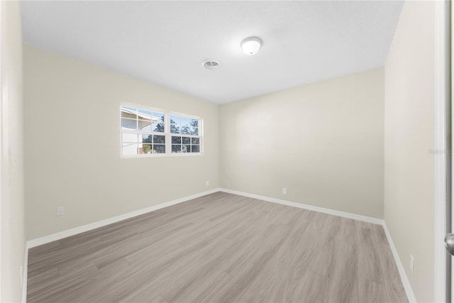 unfurnished room featuring light hardwood / wood-style flooring