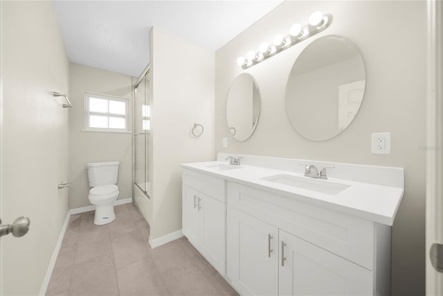 full bathroom featuring enclosed tub / shower combo, tile patterned floors, toilet, and vanity