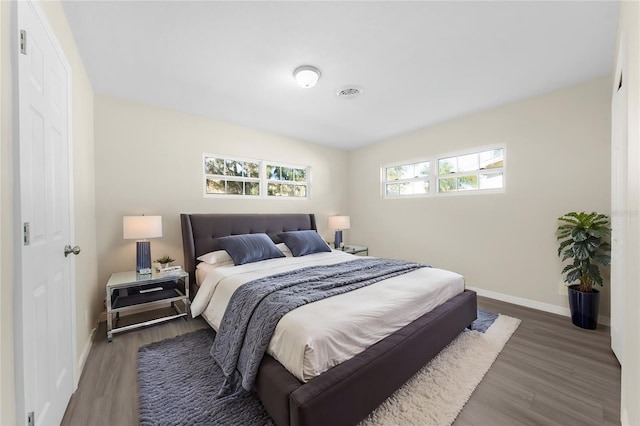 bedroom featuring dark hardwood / wood-style flooring