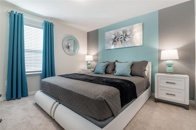 carpeted bedroom with multiple windows