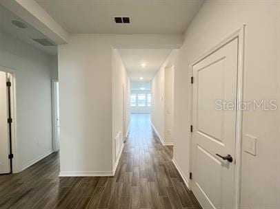 hallway featuring dark hardwood / wood-style floors