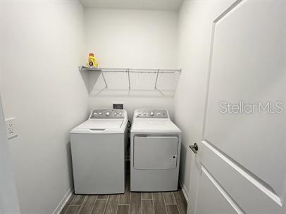 washroom featuring independent washer and dryer