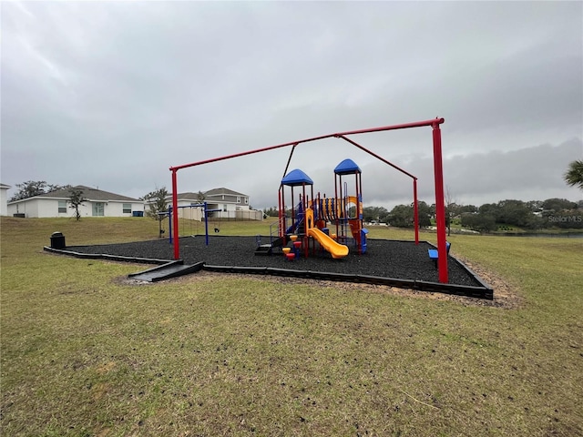 view of playground with a lawn