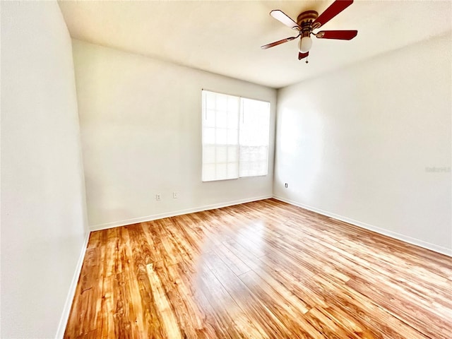 spare room featuring light hardwood / wood-style floors and ceiling fan