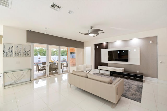 tiled living room featuring ceiling fan