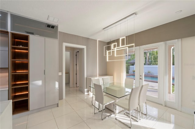 unfurnished dining area featuring light tile patterned floors