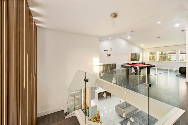 interior space featuring wood-type flooring and lofted ceiling